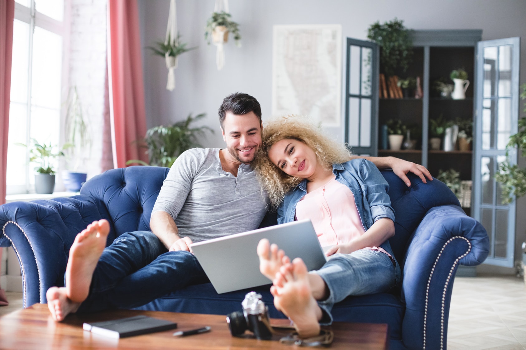 Couple on laptop looking for conveyancing quotes online